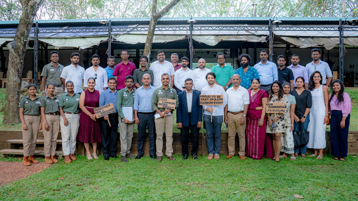 Team gathered for a low carbon event promoting eco-conscious hospitality initiatives