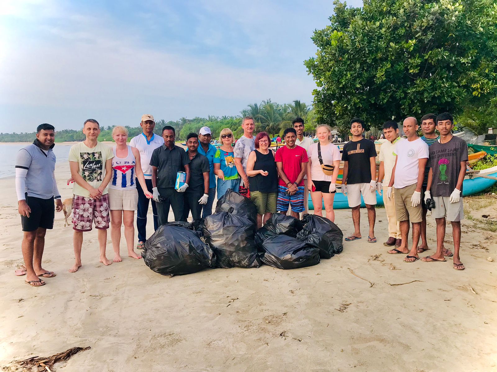 Guests and locals join for a beach cleanup, promoting waste management Sri Lanka at Maalu Maalu Resort.