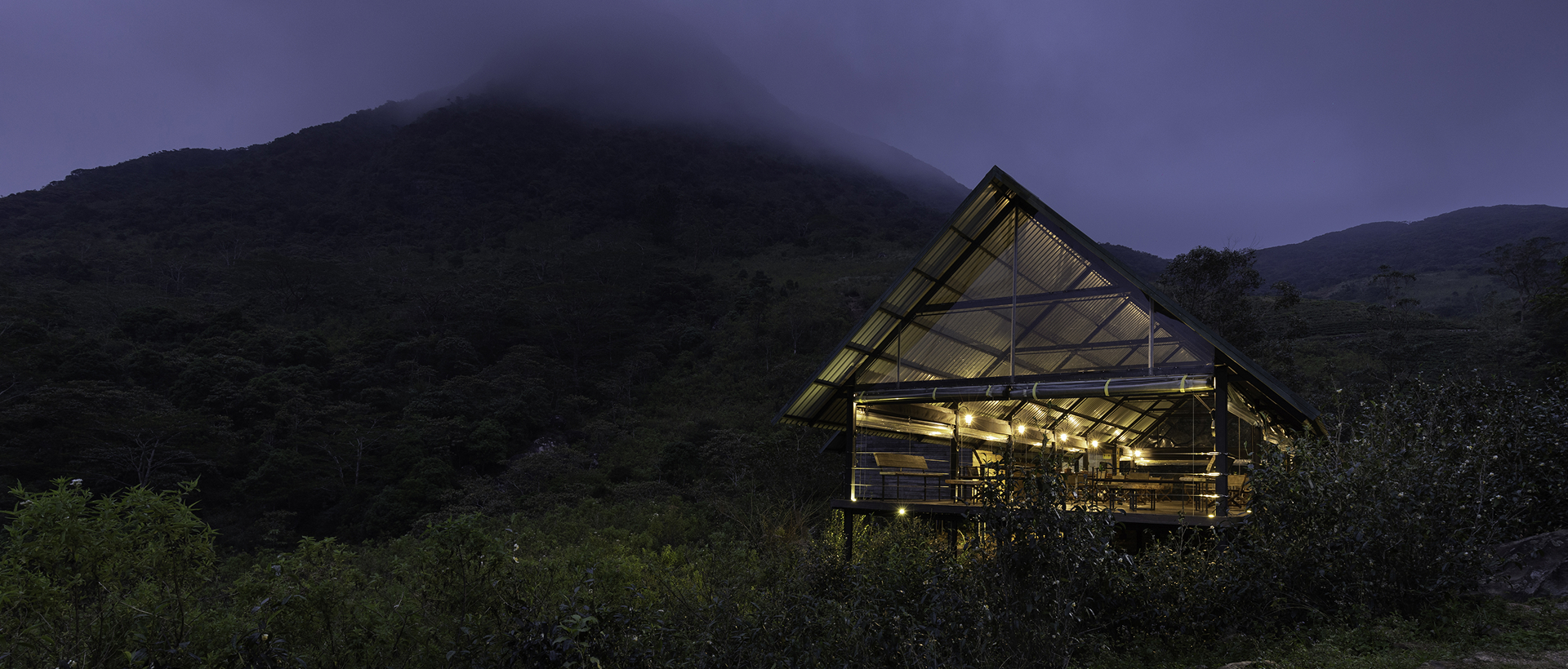 Sustainable dining space lit up under the Knuckles mist – Wild Glamping Knuckles