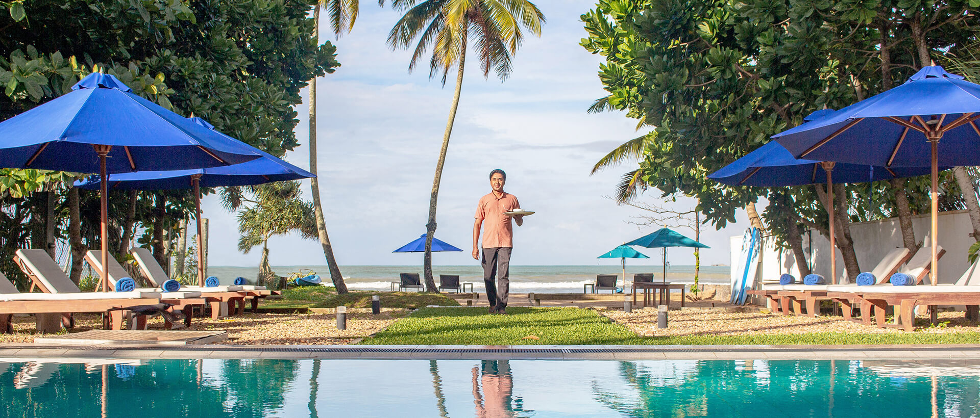 Tropical poolside moment at a boutique retreat supporting Mirissa whale watching tourism
