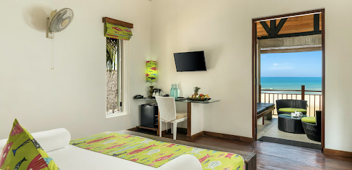 Deluxe room at Maalu Maalu eco resort in Pasikuda with natural light and coastal design, facing the ocean