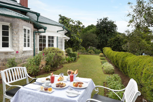 Breakfast in the garden at Mountbatten Bungalow, a hillside boutique stay in Kandy