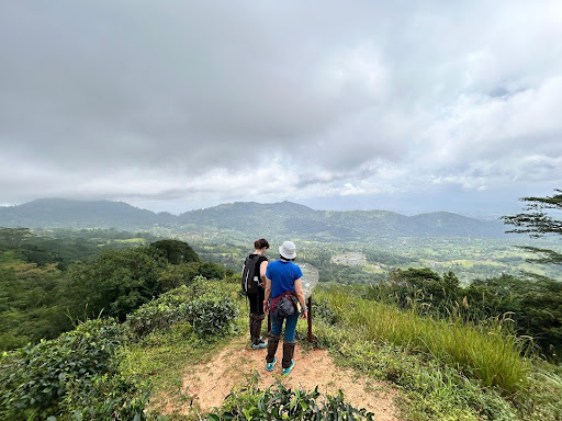 Hikers at a Pekoe Trail viewpoint near Kandy overlooking the Central Highlands