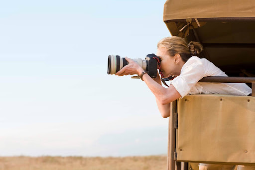 Wildlife photographer during a Yala safari experience in Sri Lanka