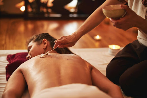 Ayurvedic herbal therapy during detox treatment done by a certified practitioner