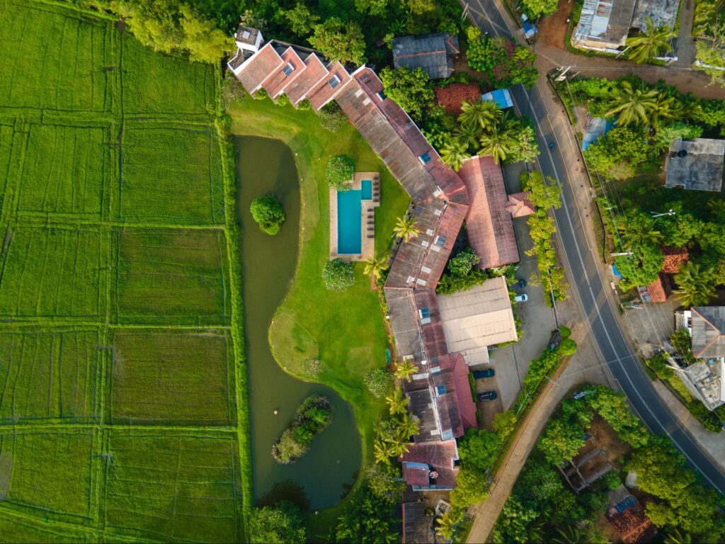 Drone view of Kithala Resort surrounded by paddy fields in Tissamaharama near Yala National Park