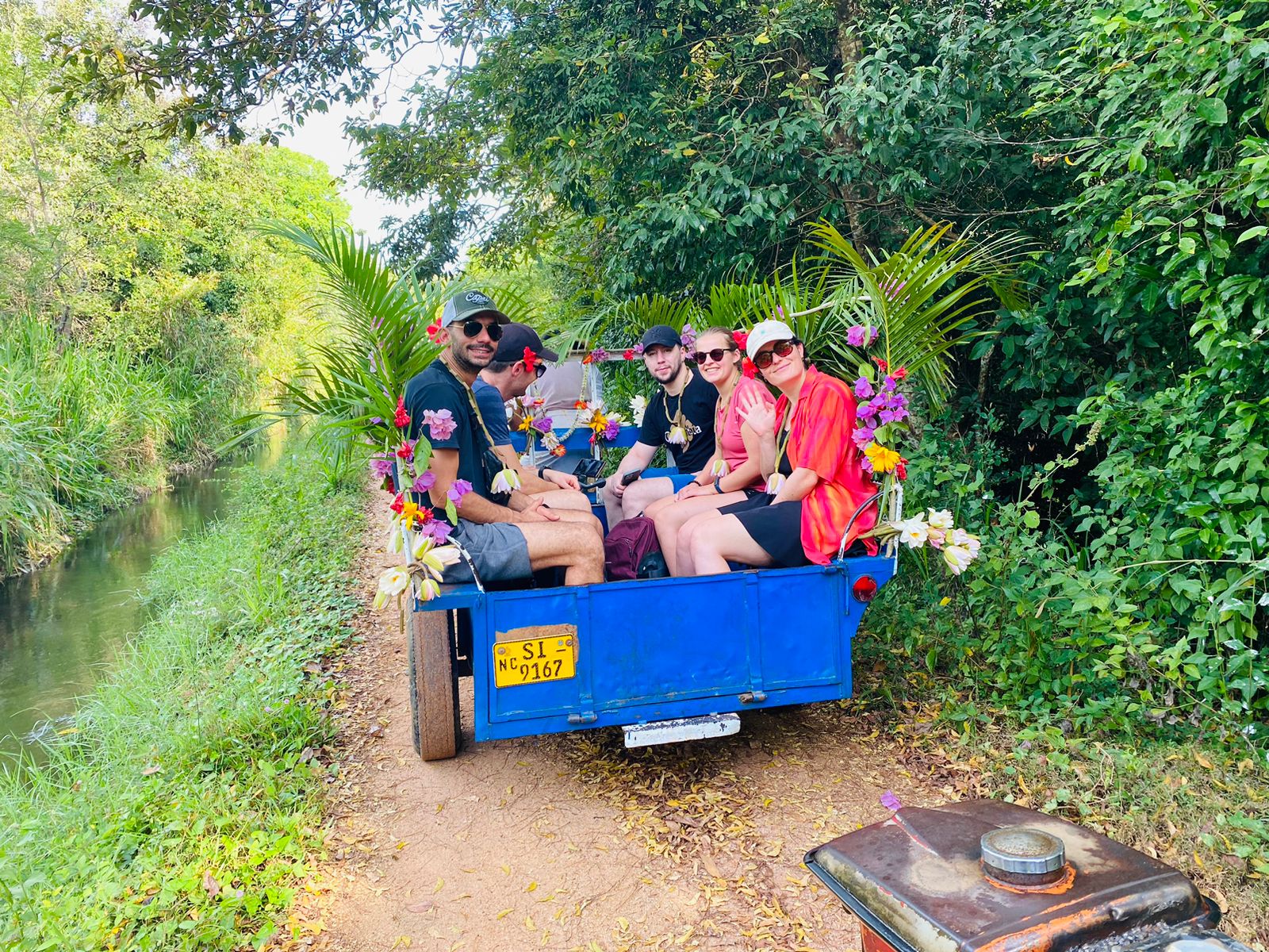 Tourists enjoying a truck ride during a Sigiriya village tour in Sri Lanka