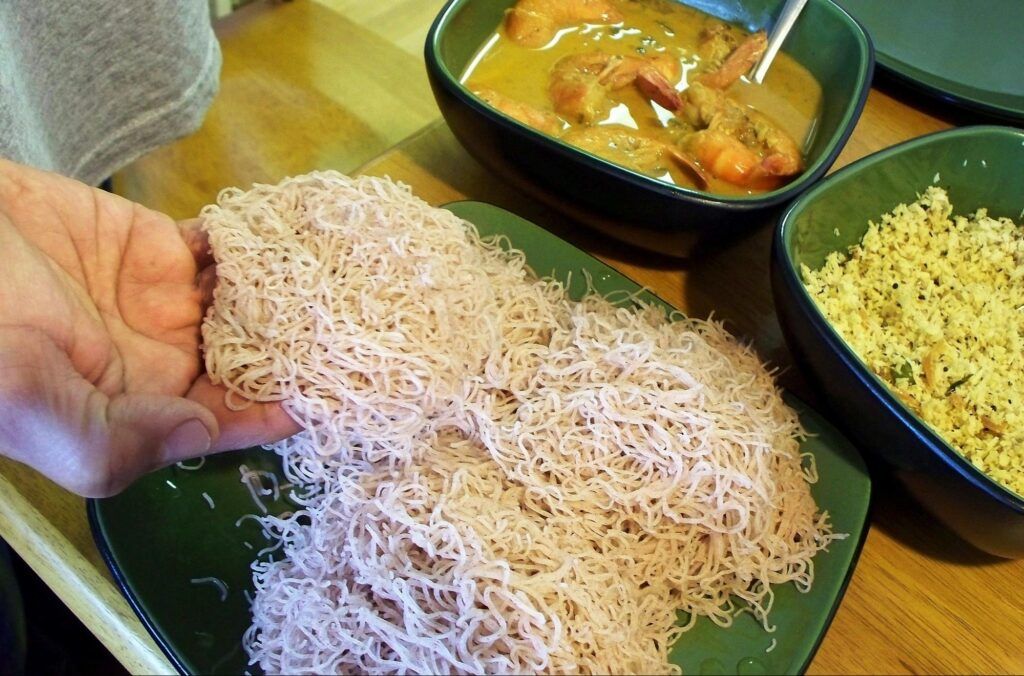 String hoppers is a Sri Lankan rice noodles served with curry and coconut sambol