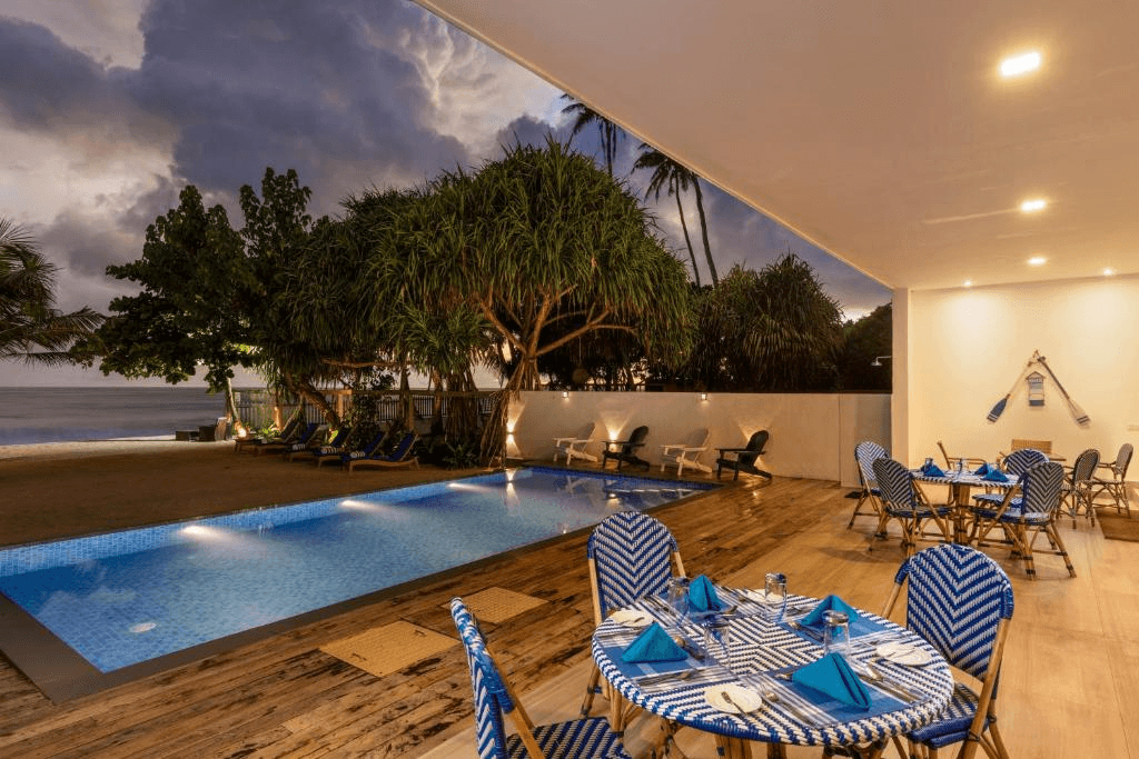 Outdoor dining terrace and pool at Vis Ta Vie Mirissa