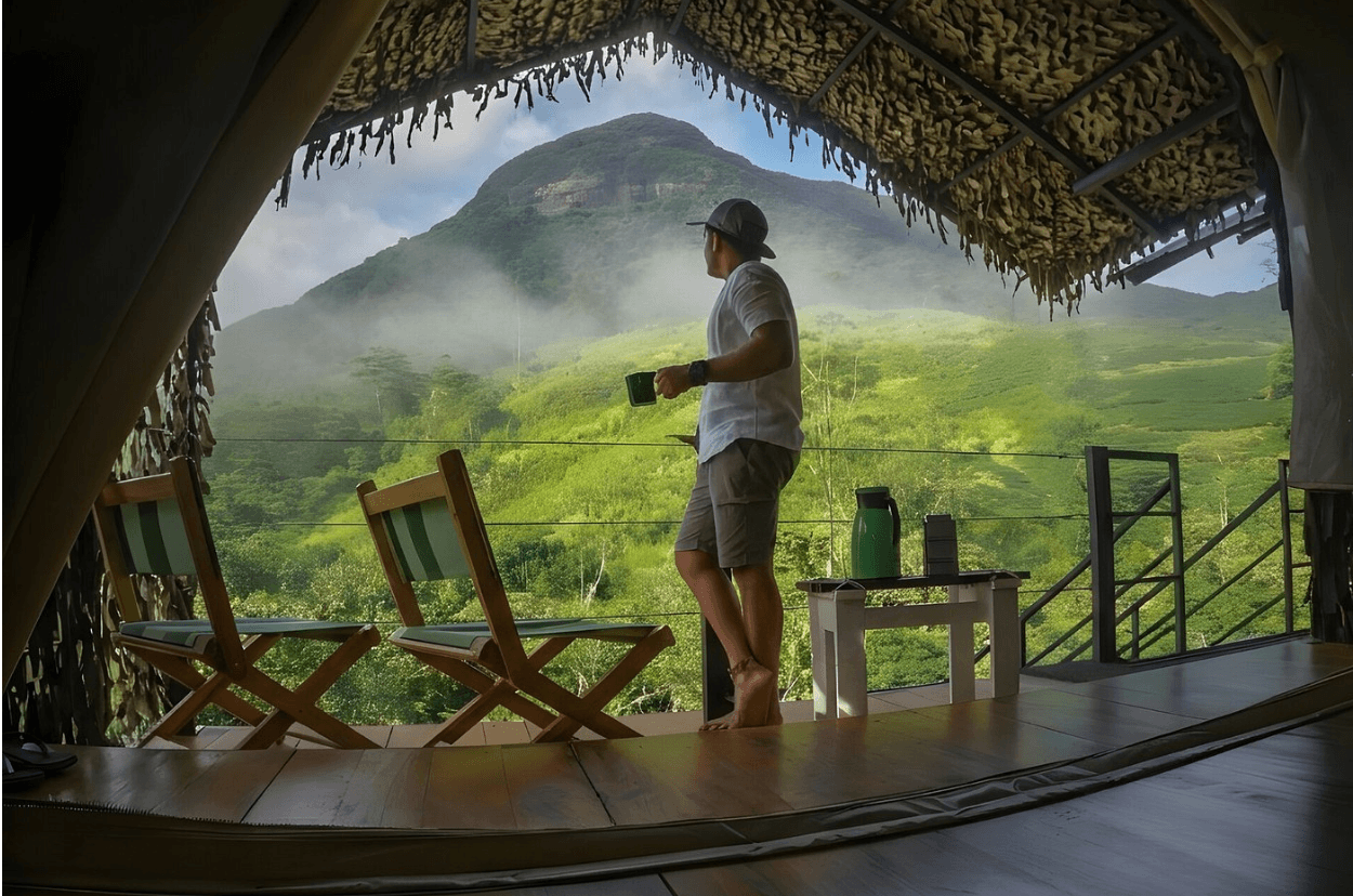 Guest looking out from a cabin toward the Knuckles mountains.