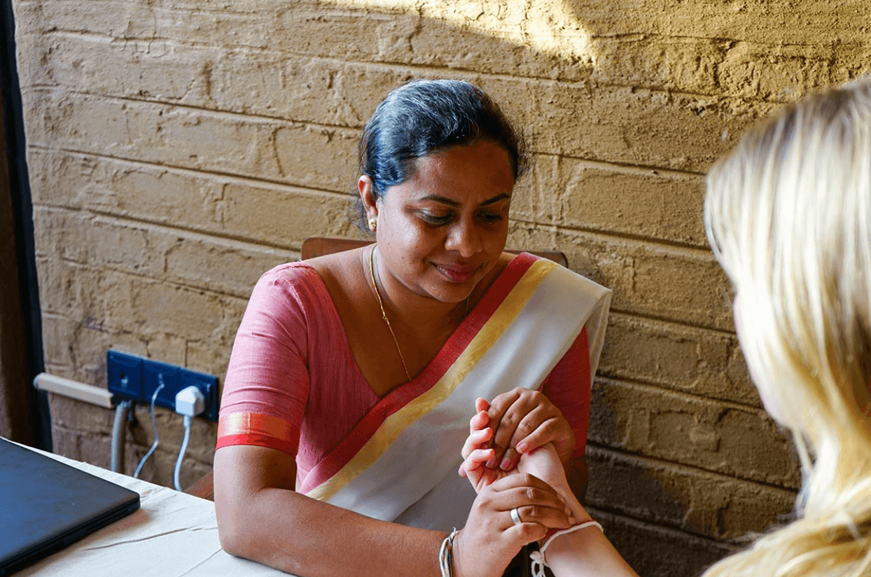 Doctor consulting with a guest at Ayurvie Sigiriya.