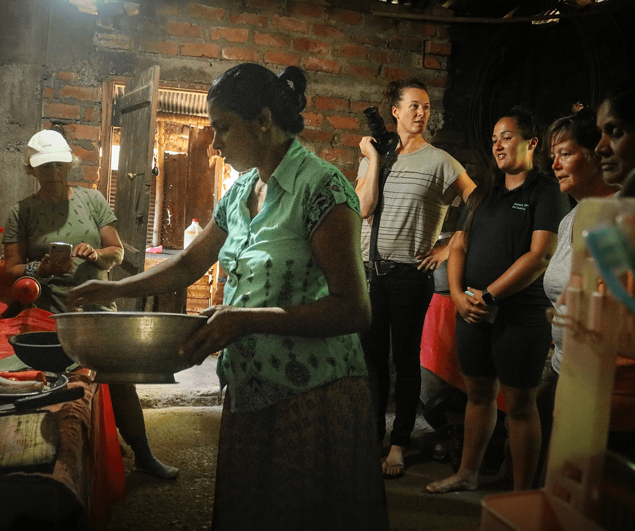 Villager preparing a traditional Sri Lankan meal during a cooking demonstration near Heel Oya